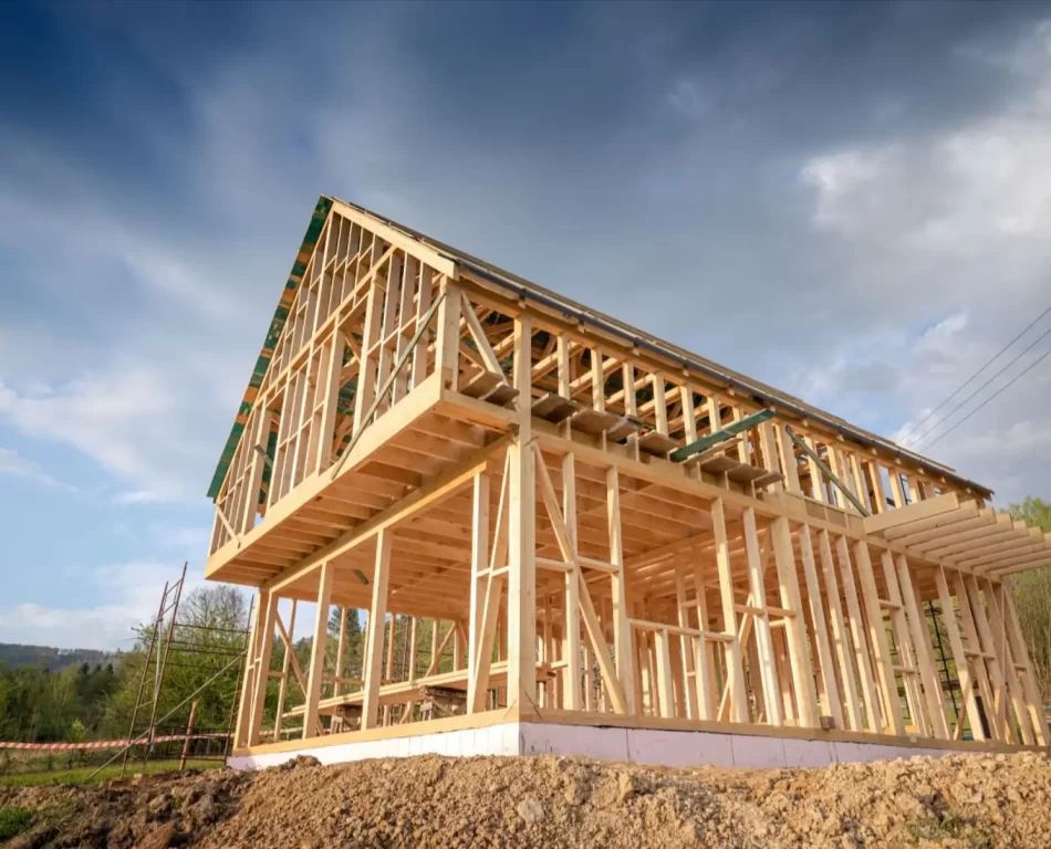 View of a barn style residence under construction.